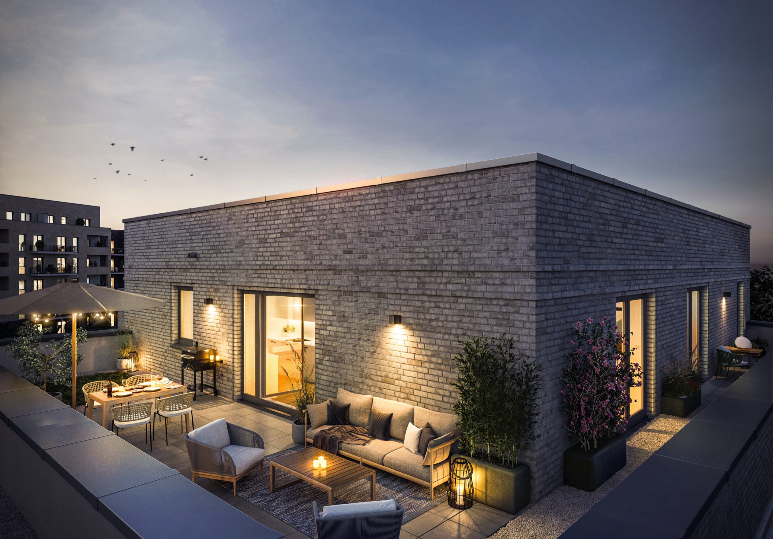 - Moderne Dachterrasse mit Sitzbereich und Pflanzen bei Sonnenuntergang.